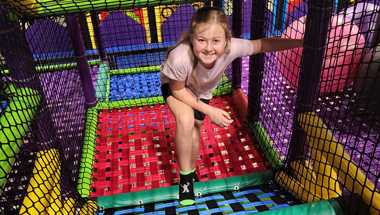 Young Girl On Play Maze