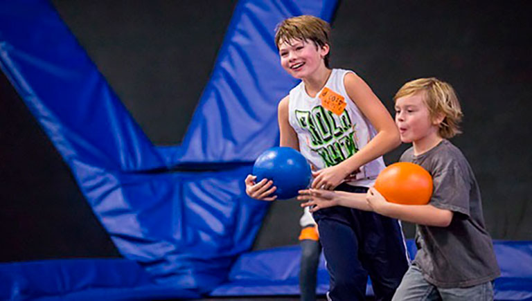 Boys Play In Trampoline Area