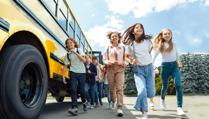 Kids Getting Off Of School Bus
