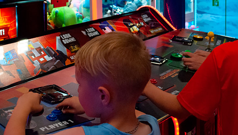 Kids Playing Arcade Game