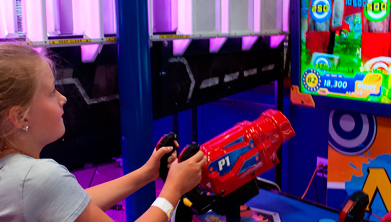 Kid Playing Arcade Game